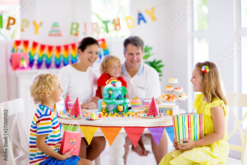 Child birthday party cake. Family with kids.