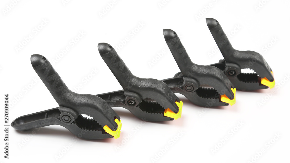 Obraz premium four black pegs on a white background. work items