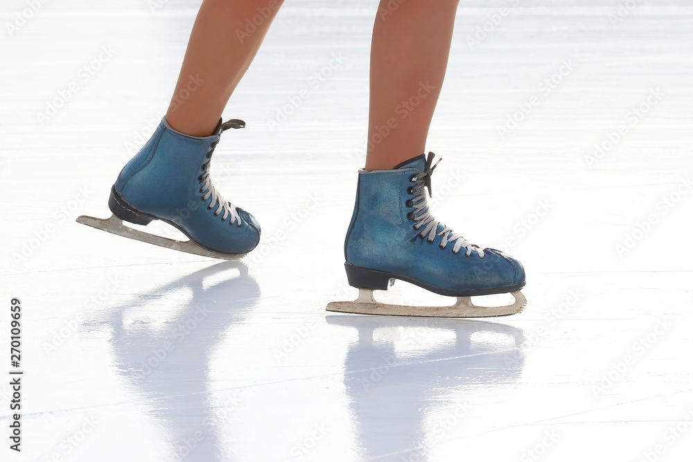 feet skating girl skating on ice rink.. Hobbies and recreation. Sports and holidays feet skating girl skating on ice rink.. Hobbies and recreation. Sports and holidays