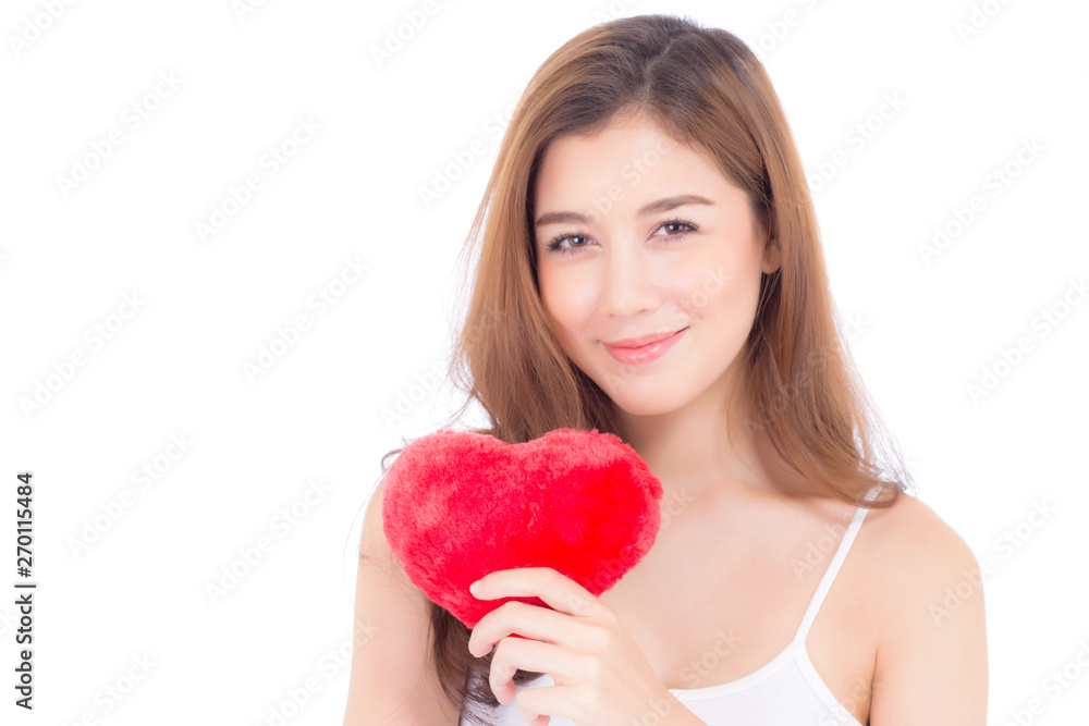 Portrait of beautiful asian young woman holding red heart shape pillow and smile isolated on white background, valentines day, holiday concept. Portrait of beautiful asian young woman holding red heart shape pillow and smile isolated on white background, valentines day, holiday concept.