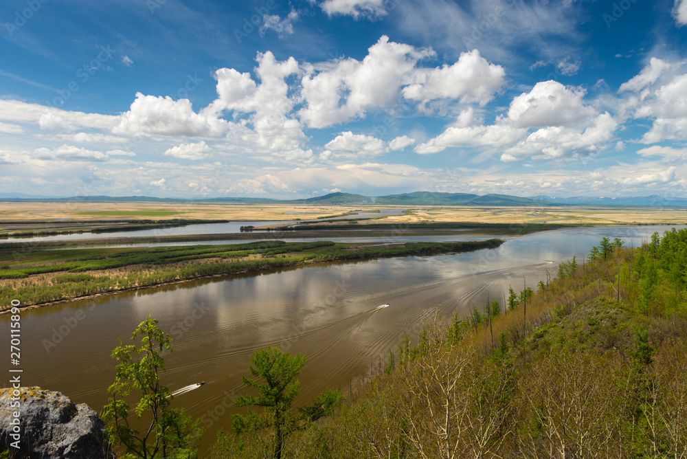 Cliff Aury on the Amur River. Khabarovsk region of the Russian Far East. View on the River Amur with Cliff Aury. Cliff Aury on the Amur River. Khabarovsk region of the Russian Far East. View on the River Amur with Cliff Aury.