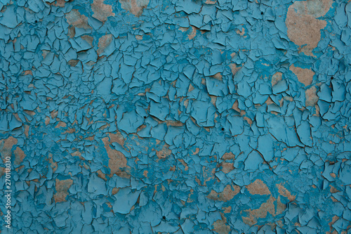 blue paint on the surface peeled off, peeled off and cracked from time and natural elements