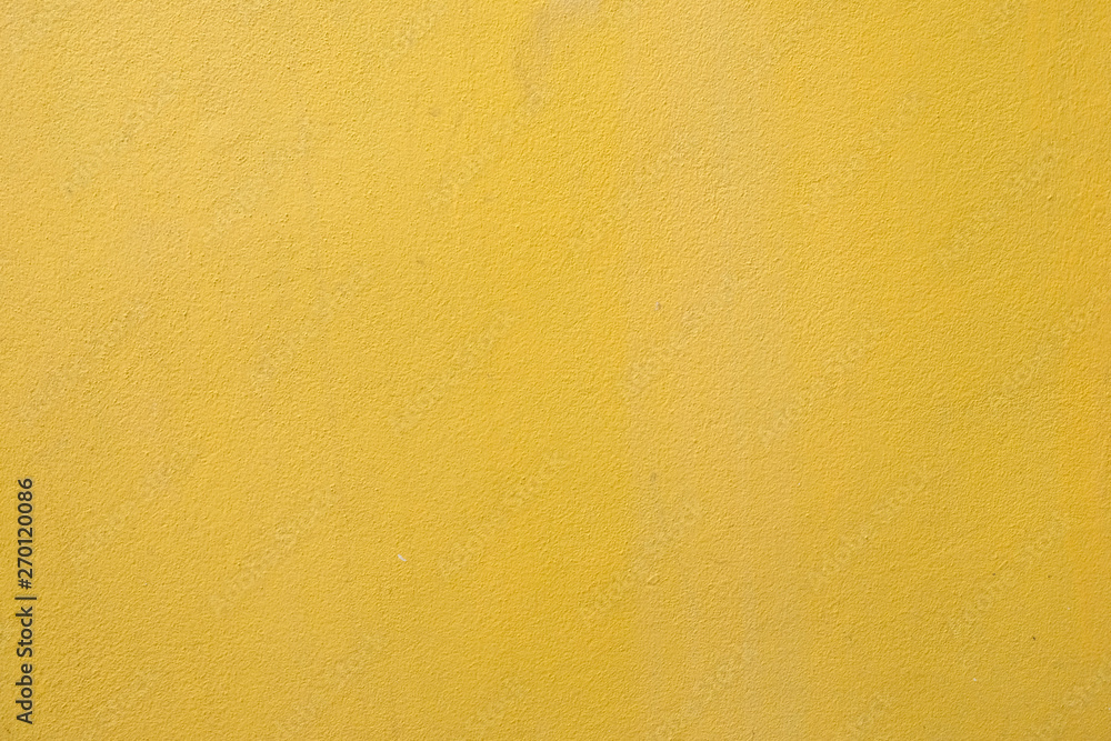 yellow cement wall background close up yellow cement wall background close up