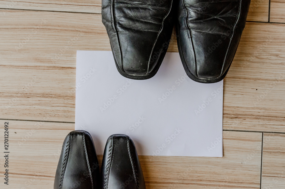 Happy fathers day, fathers shoes and baby boys shoes overhead, flat lay Happy fathers day, fathers shoes and baby boys shoes overhead, flat lay