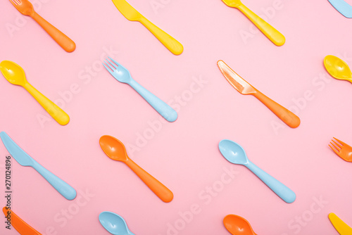 Colorful dining set on pink background