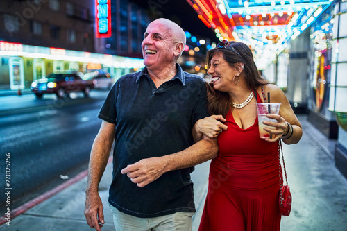 Photography mature couple sightseeing in downtown las vegas streets