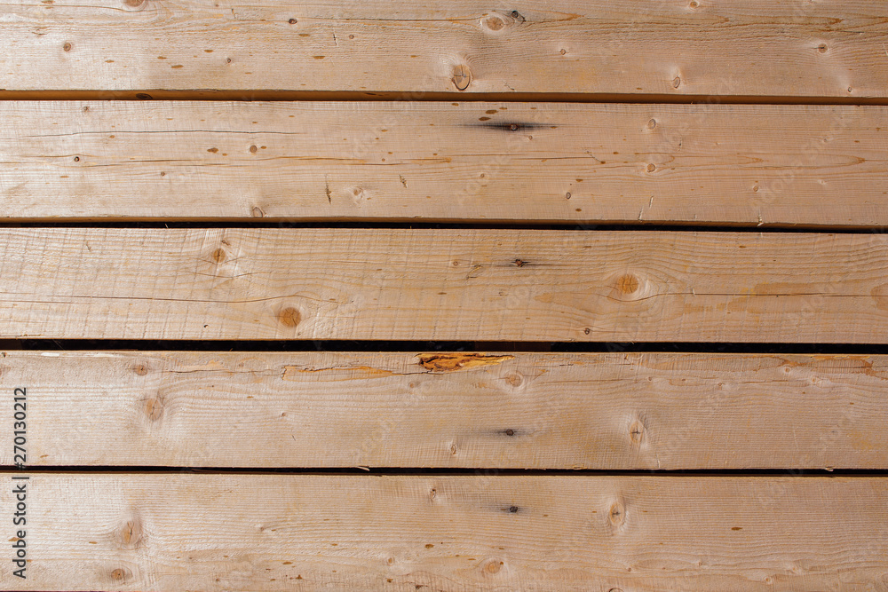 Naklejka premium Wooden natural texture. Brown wooden planks background.