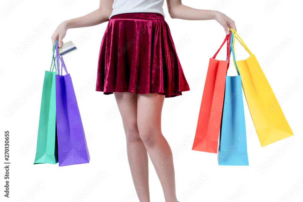 Happy woman in summer enjoying shopping holding credit card and colorful shopping bag on white background, shopping concept, isolate concept.