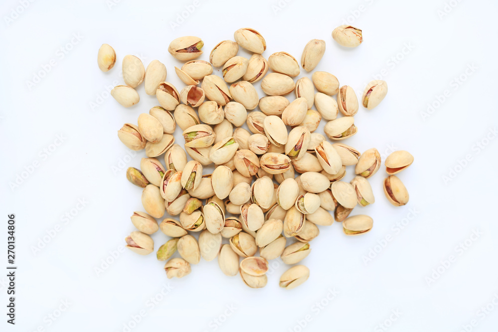Pistachio nuts isolated on white background. Top view. Pistachio nuts isolated on white background. Top view.