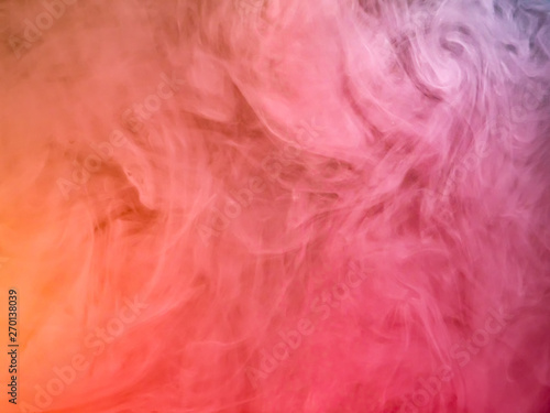 Pink acrylic paint cloud, close up view. Blurred background. Ink dropped into water, abstract background. Acrylic smoke under water, abstract pattern. Abstract art background for wallpapers