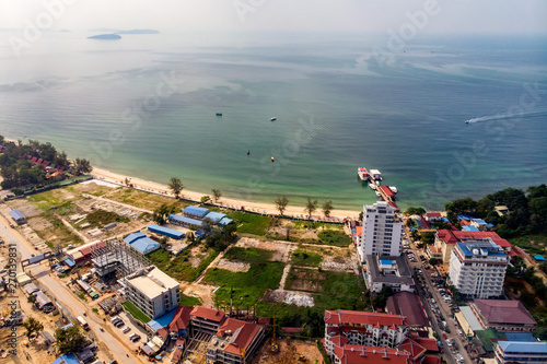 Top view of wasteland by the sea and buildings under construction in Sihanoukville, Cambodia photo