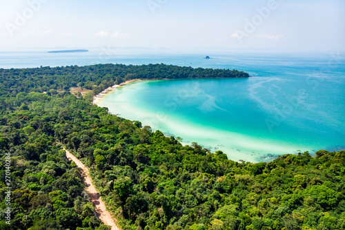Top view of a beautiful tropical island with dense forest or jungle. long beach in tropical paradise snake island near sihanoukville cambodia photo