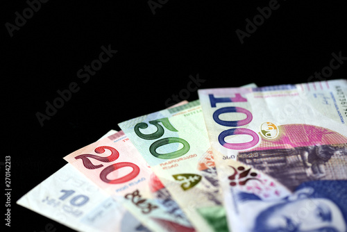 Georgian lari banknotes on a dark background close up