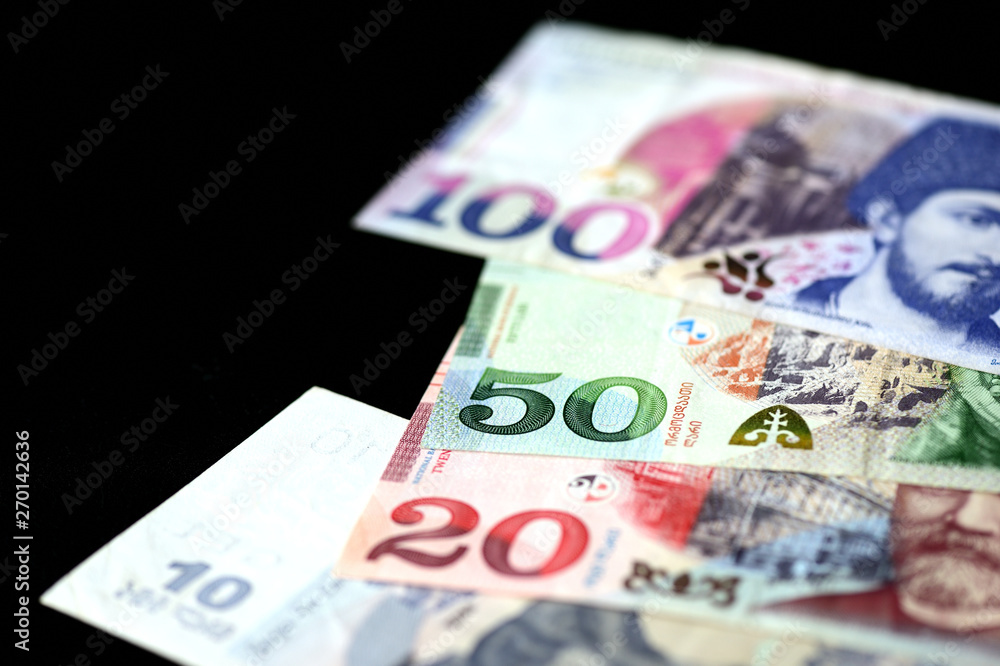 Georgian lari banknotes on a dark background close up Georgian lari banknotes on a dark background close up
