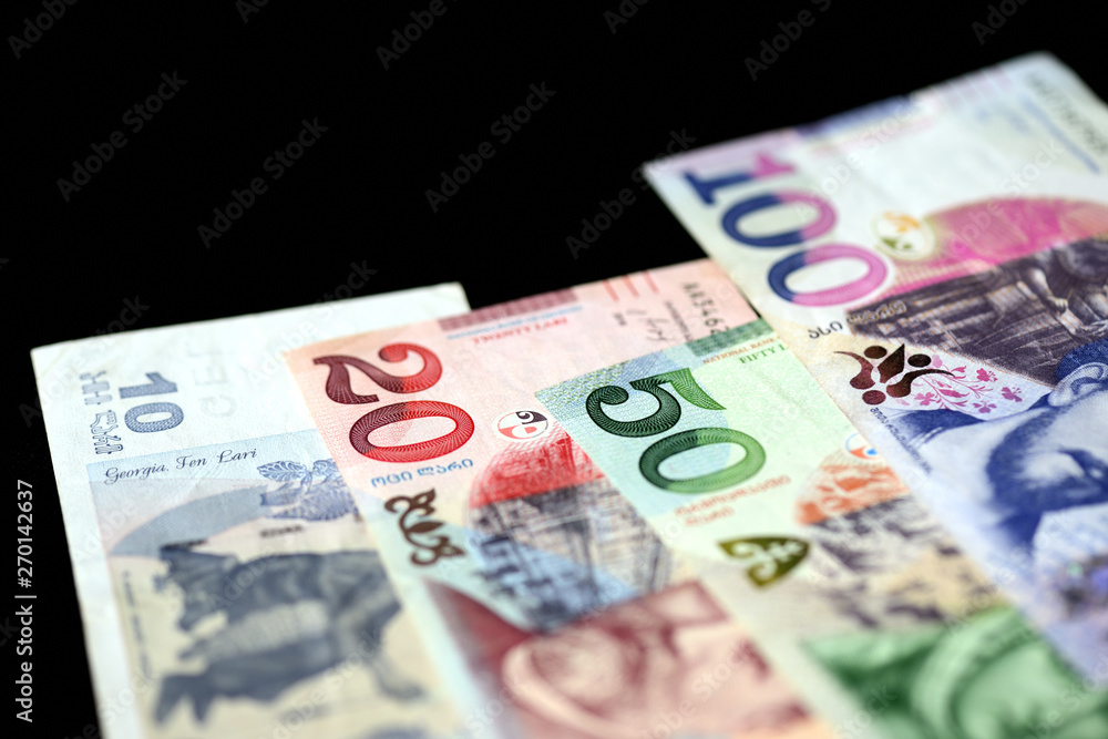 Georgian lari banknotes on a dark background close up Georgian lari banknotes on a dark background close up