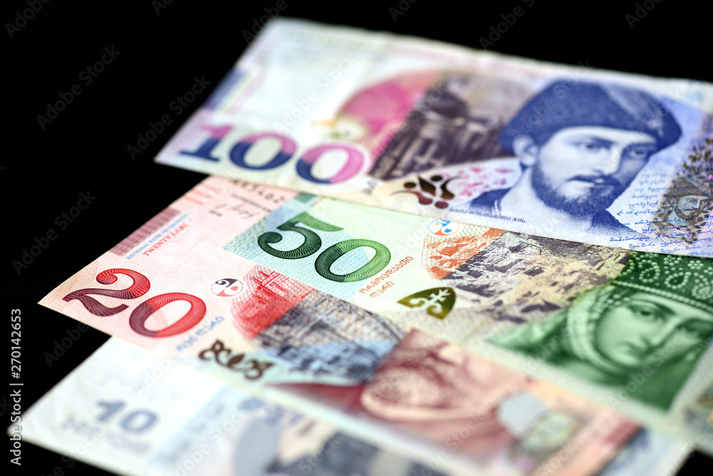 Georgian lari banknotes on a dark background close up Georgian lari banknotes on a dark background close up