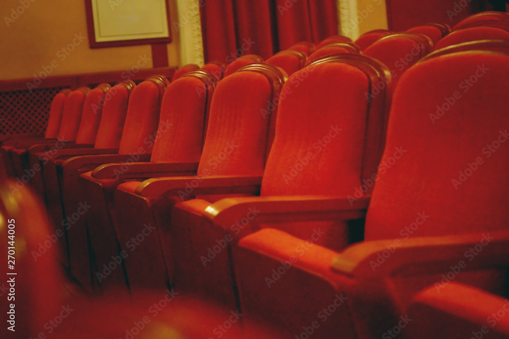 Obraz premium Old cinema/theatre. Empty seats in theater. Film industry, art, audience love concept.