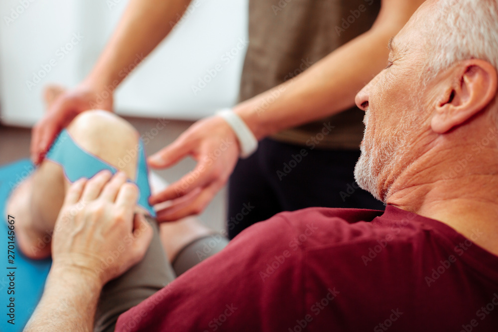 Fototapeta premium Selective focus of a nice aged man with trauma