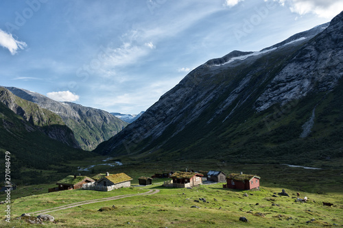 Mountain landscape with traditional sod roofs on log buildings, in Norway
