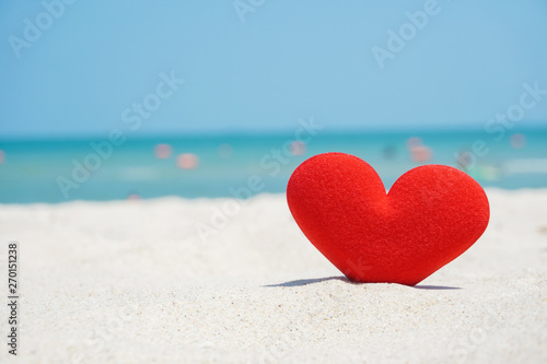 red heart shape on beach sand   love the sea
