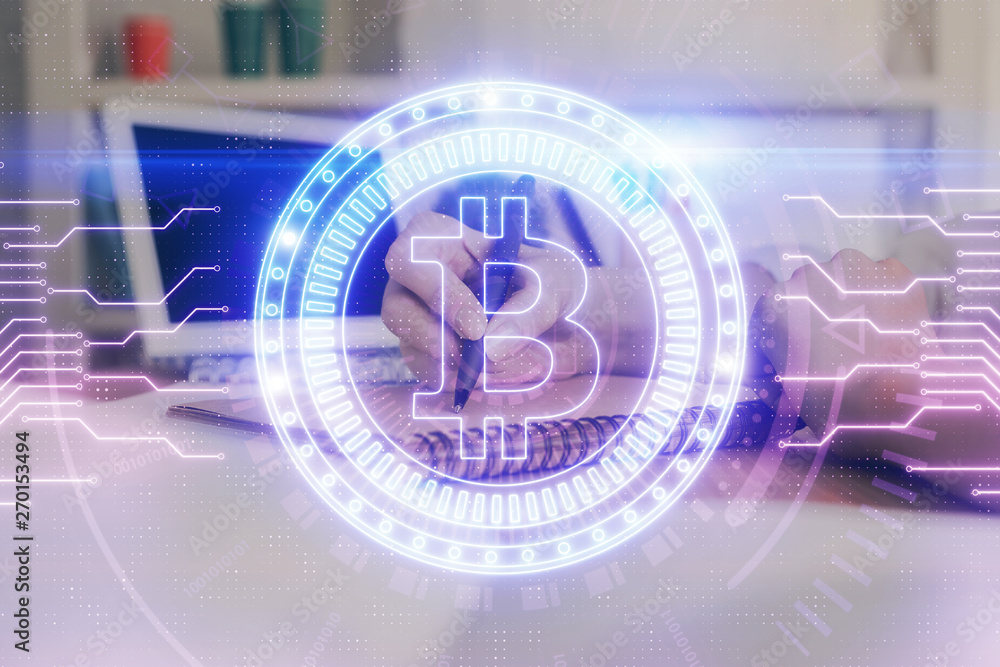Cryptocurrency hologram over hands taking notes background. Concept of blockchain. Multi exposure Cryptocurrency hologram over hands taking notes background. Concept of blockchain. Multi exposure
