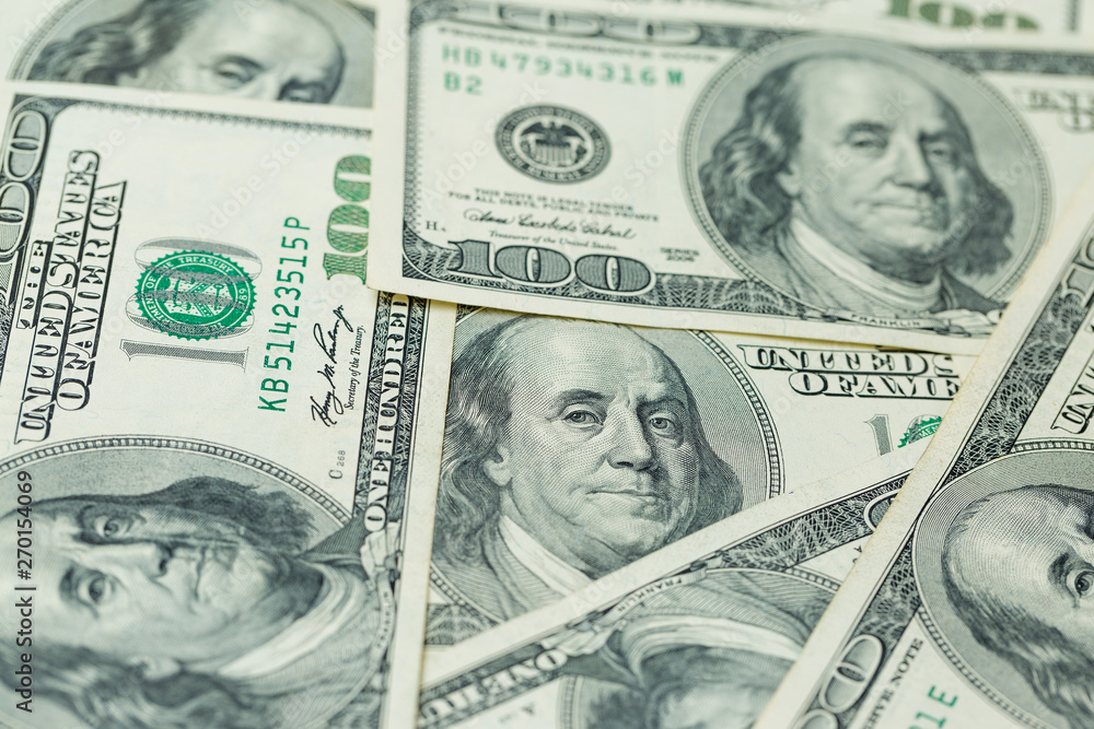 Background of one hundred dollar bills. Benjamin Franklin on USA money banknote Background of one hundred dollar bills. Benjamin Franklin on USA money banknote
