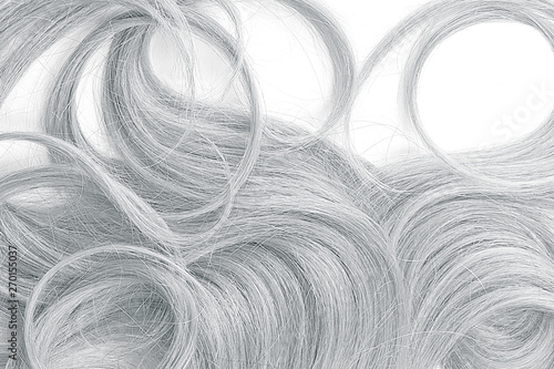 Curly gray hair as background, texture. One of the popular shades of hair coloring photo
