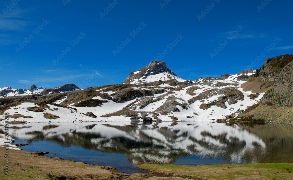 Mountain lake reflection in the french Pyrenees
