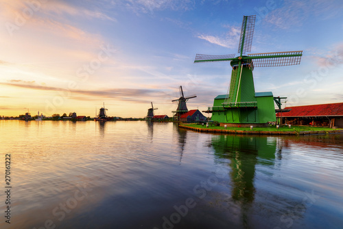 Dutch landscape with windmill at dramatic sunset, Zaandam, Amsterdam, Netherlands
