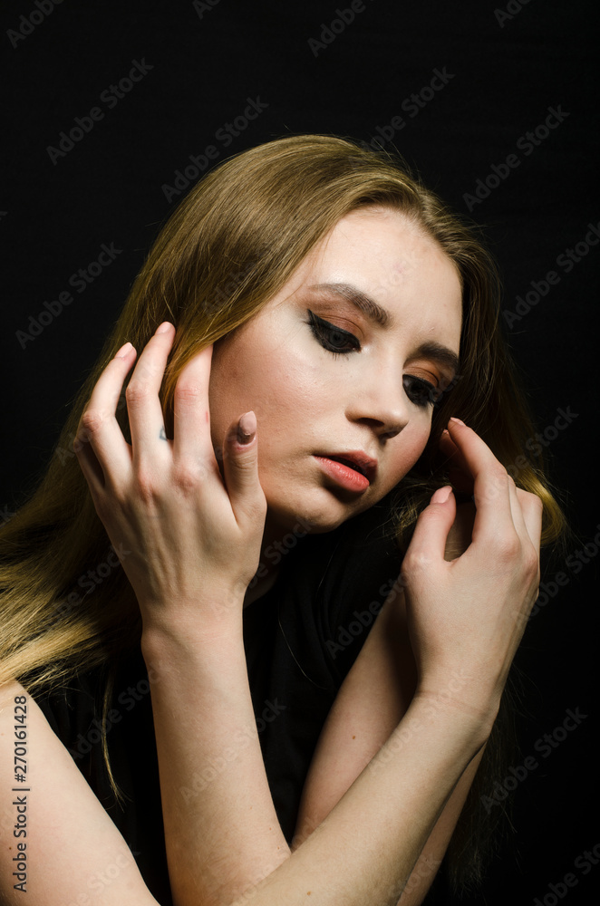 Fototapeta premium beautiful girl in a t-shirt in the Studio