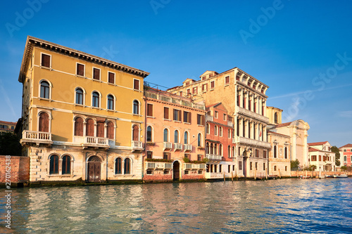 Old houses by Grand Canal in Venice  Italy  on a bright day