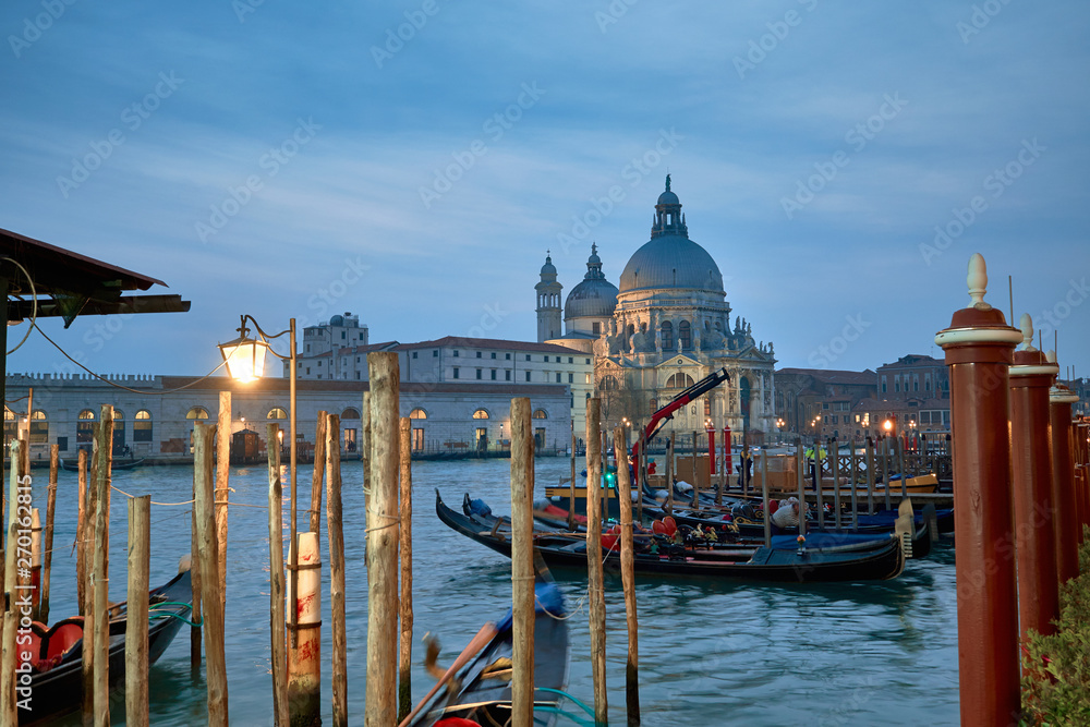 Gondolas moored on the bank of Grand Canal in Venice, Italy