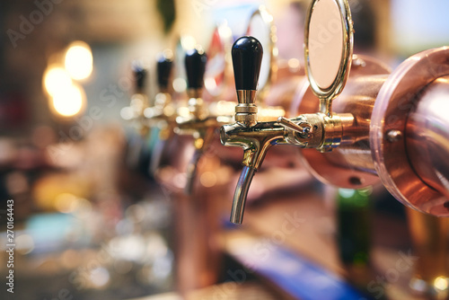 Shot of beer tap in the pub photo
