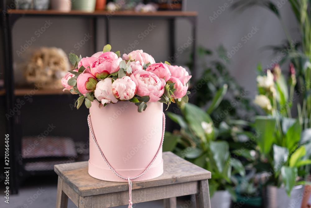 Pink peonies on the old grey table. Beautiful peony flower for catalog or online store. Floral shop concept . Beautiful fresh cut bouquet. Flowers delivery Pink peonies on the old grey table. Beautiful peony flower for catalog or online store. Floral shop concept . Beautiful fresh cut bouquet. Flowers delivery