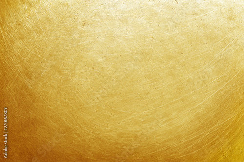 aluminium metal texture background with golden color, pattern of scratches on stainless steel.