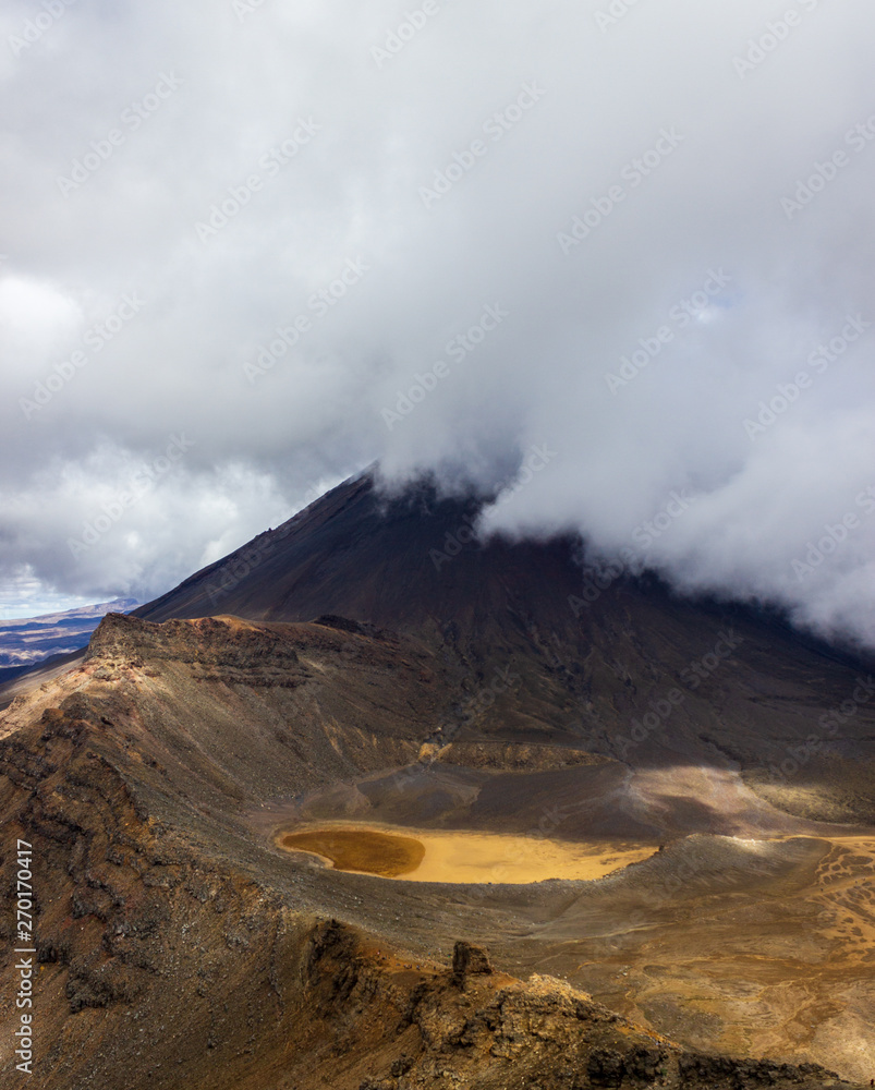 Mount Ngauruhoe covered behind clouds in the Tongariro National Park, New Zealand