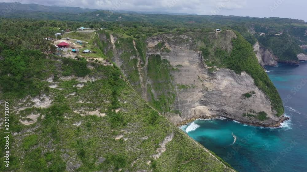 Aerial drone video of beautiful exotic beach with green rocks, Kelingking beach, Nusa Penida, Bali, Indonesia, 4K Aerial drone video of beautiful exotic beach with green rocks, Kelingking beach, Nusa Penida, Bali, Indonesia, 4K