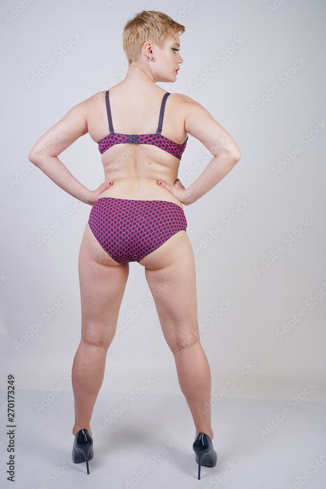 Beautiful young caucasian chubby woman with plus size body and pale skin  wearing lace sexy lingerie on white studio background alone Stock Photo |  Adobe Stock