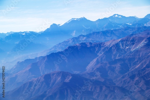 Misty blue Andean mountain landscape background