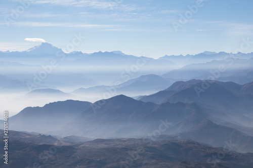 Fototapeta Naklejka Na Ścianę i Meble -  Misty blue Andean mountain landscape background