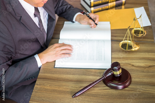 gavel and soundblock of justice law and lawyer working on wooden desk background. photo