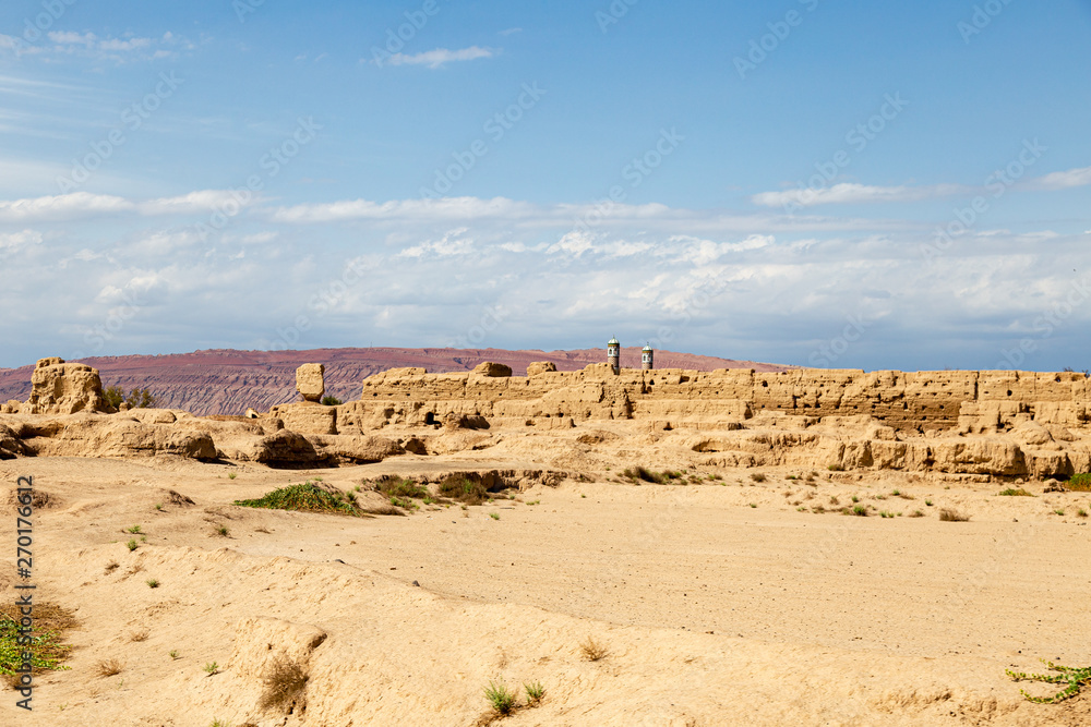 Ruins of Gaochang, Turpan, China. Dating more than 2000 years, Gaochang and Jiaohe are the oldest and largest ruins in Xinjiang. The Flaming mountains are visible in the background Ruins of Gaochang, Turpan, China. Dating more than 2000 years, Gaochang and Jiaohe are the oldest and largest ruins in Xinjiang. The Flaming mountains are visible in the background