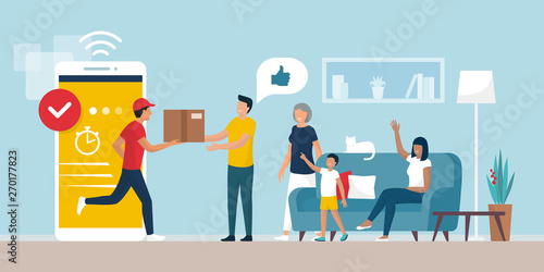 Delivery man delivering a box to a family