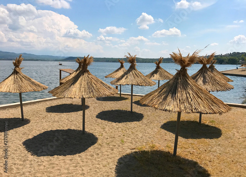 Beach umbrellas in Dojran, Macedonia photo