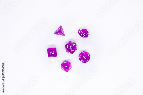 Purple dices for fantasy dnd and rpg tabletop games. Board game polyhedral dices with different sides isolated on white background