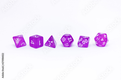 Purple dices for fantasy dnd and rpg tabletop games. Board game polyhedral dices with different sides isolated on white background