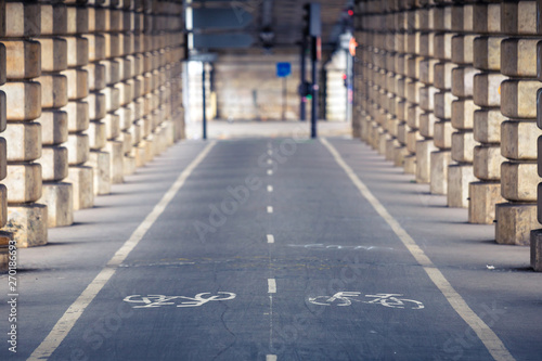 Separate bicycle lane for bicycles. White painted bike on asphalt .