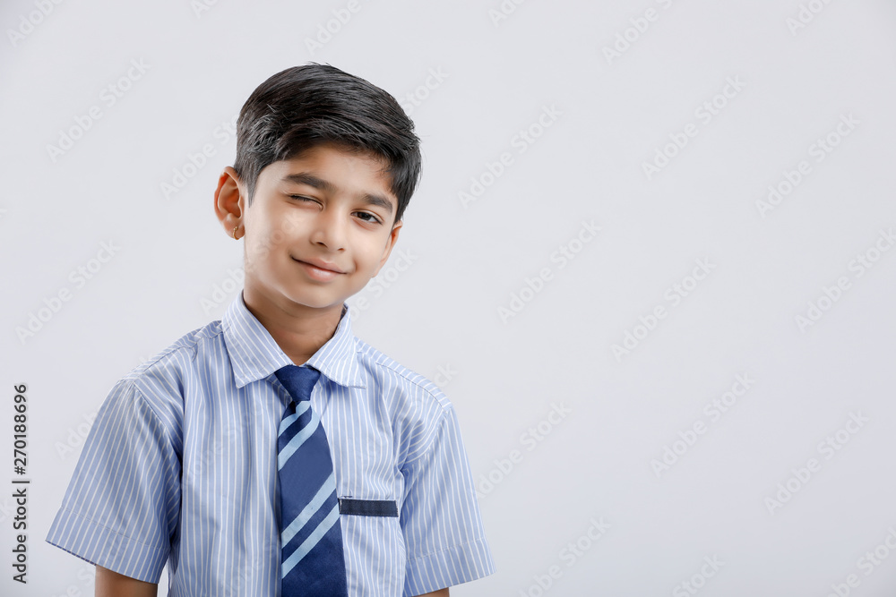 Cute little indian Indian / Asian school boy wearing uniform Cute little indian Indian / Asian school boy wearing uniform