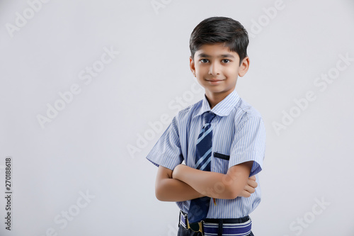 Fotografija Cute little indian Indian / Asian school boy wearing uniform