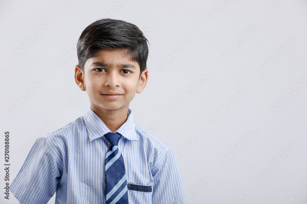 Cute little indian Indian / Asian school boy wearing uniform Cute little indian Indian / Asian school boy wearing uniform